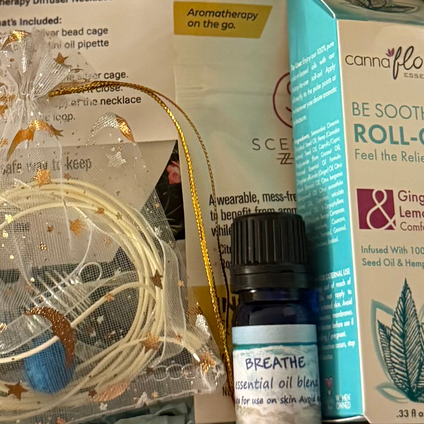 An aromatherapy essential oil subscription box of scented wellness products featuring Breathe essential oil blend.