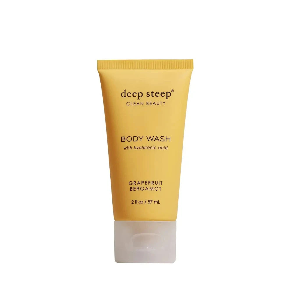 Yellow tube of deep steep body wash on a white background