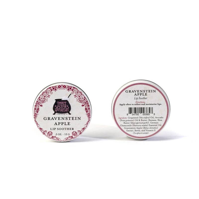 Two tins of Gravenstein Apple lip soother with decorative labels on a white background